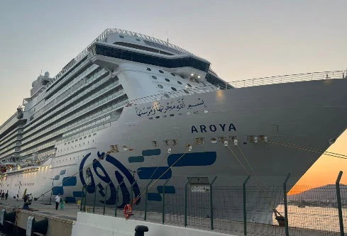 The Aroya cruise ship docked at dusk