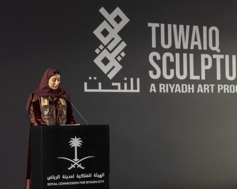 Sarah Alruwayti, Director of Tuwaiq Sculpture, speaking at the preview night