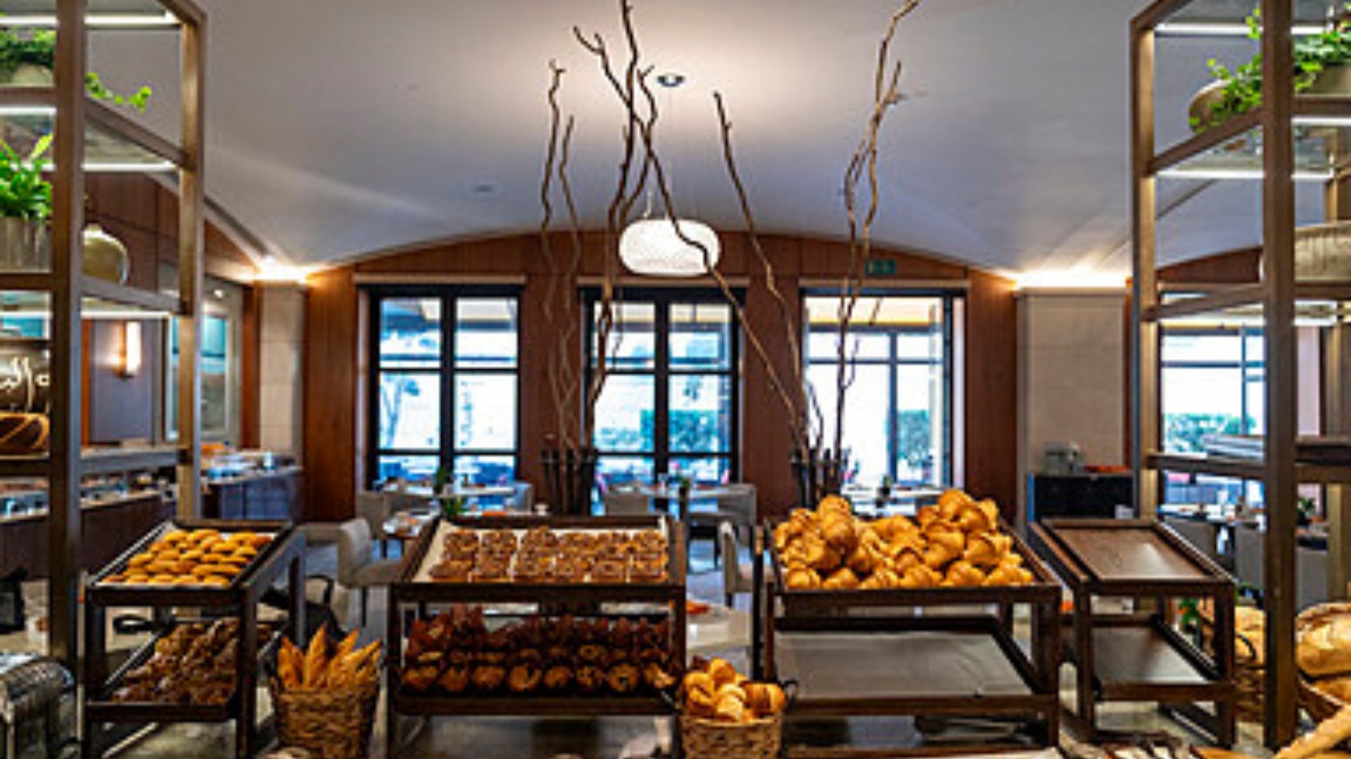 The Signature Breakfast Buffet At Four Seasons Hotel Amman Showcases Freshly Baked Pastries, Artisan Breads, And Elegant Contemporary Interiors