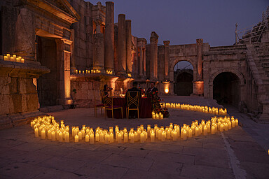 The Candlelit Roman Amphitheater Experience In Amman Offers An Enchanting Evening Setting Near Four Seasons Hotel Amman, Blending Ancient Heritage With Refined Cultural Ambiance