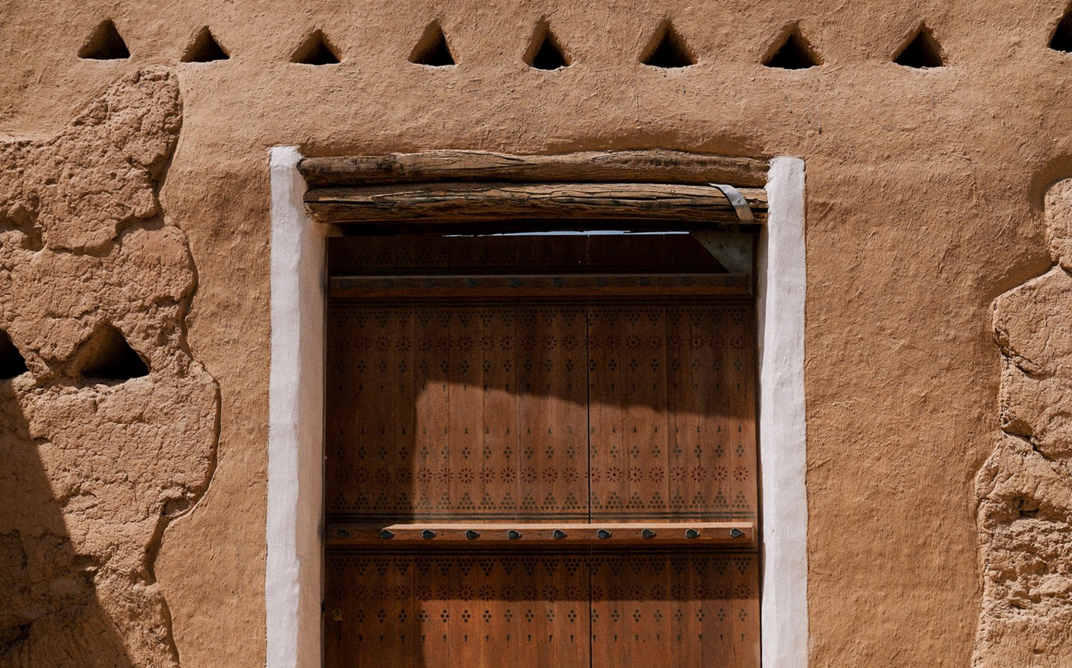 Figure 1 - A preserved Najdi doorway in historic Diriyah, showcasing the architectural details that continue to inspire Saudi design today