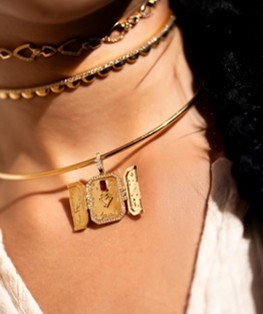 Figure 2 - Set with a central ruby and engraved with a verse from the region’s most enduring love story, the Love Locket captures a story of enduring love