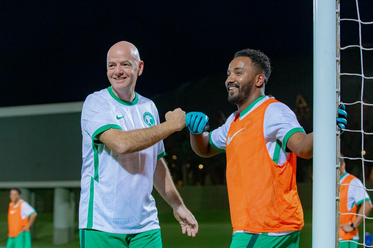 Mazen Aljari in his football player era with FIFA President Gianni Infantino