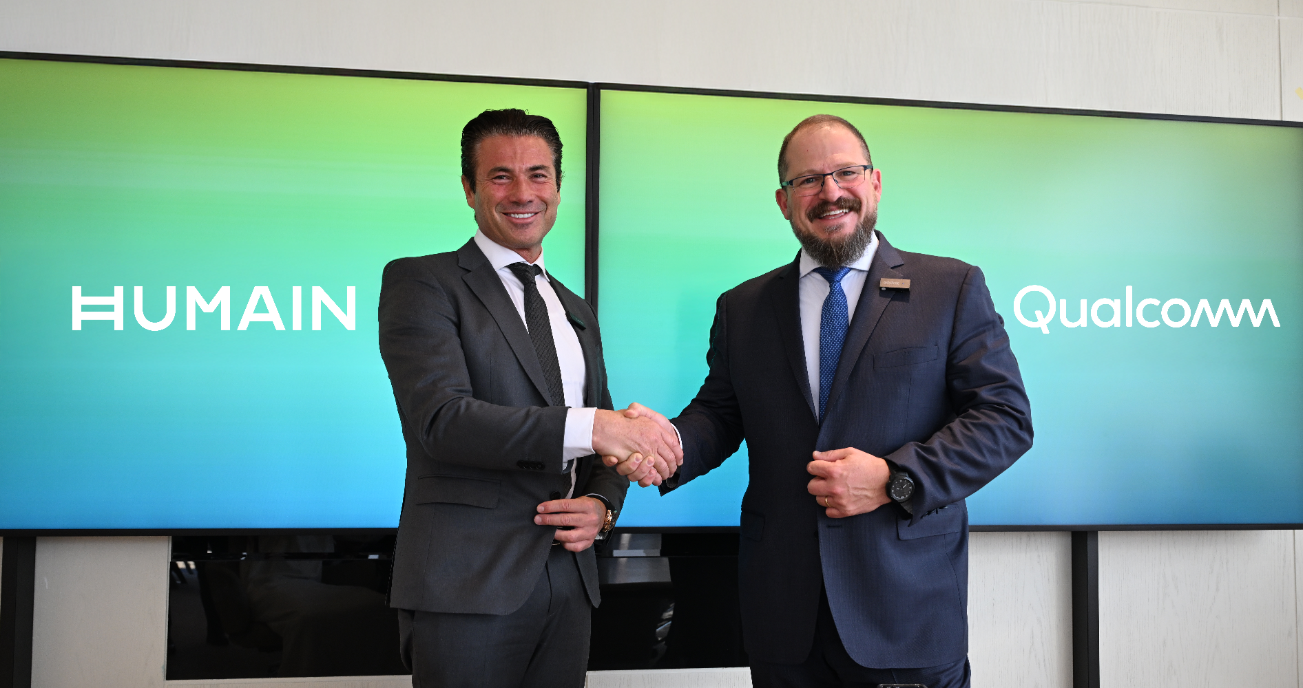Qualcomm President and CEO Cristiano Amon and HUMAIN CEO Tareq Amin, whose companies are collaborating to develop AI data center infrastructure in Saudi Arabia.
